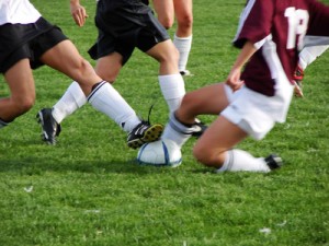 Girl fighting for Soccer Ball