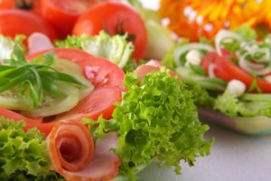 Fresh salad with onion, tomato and basil
