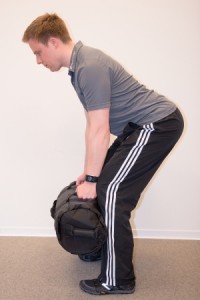 Ausgangsposition Sandbag Rudern