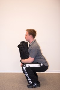 Umkehrpunkt der Sandbag Kniebeuge